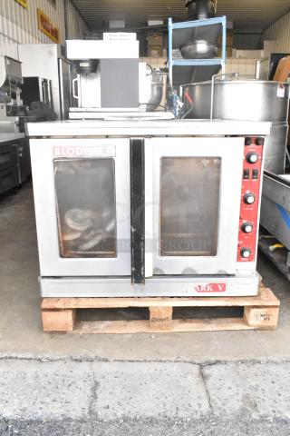 Blodgett Mark V Commercial Convection Oven, full size, view-through doors, thermostatic controls, legs on casters.