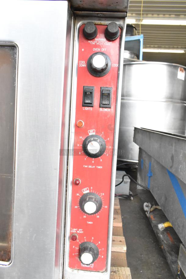 Blodgett Mark V commercial convection oven with view-through doors, thermostatic controls, legs on casters, visible control panel.
