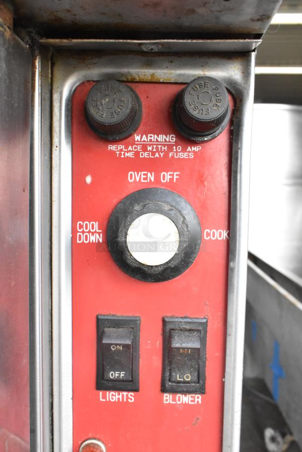 Blodgett Mark V commercial convection oven control panel with dials, switches, and warning label for 10 amp fuses.