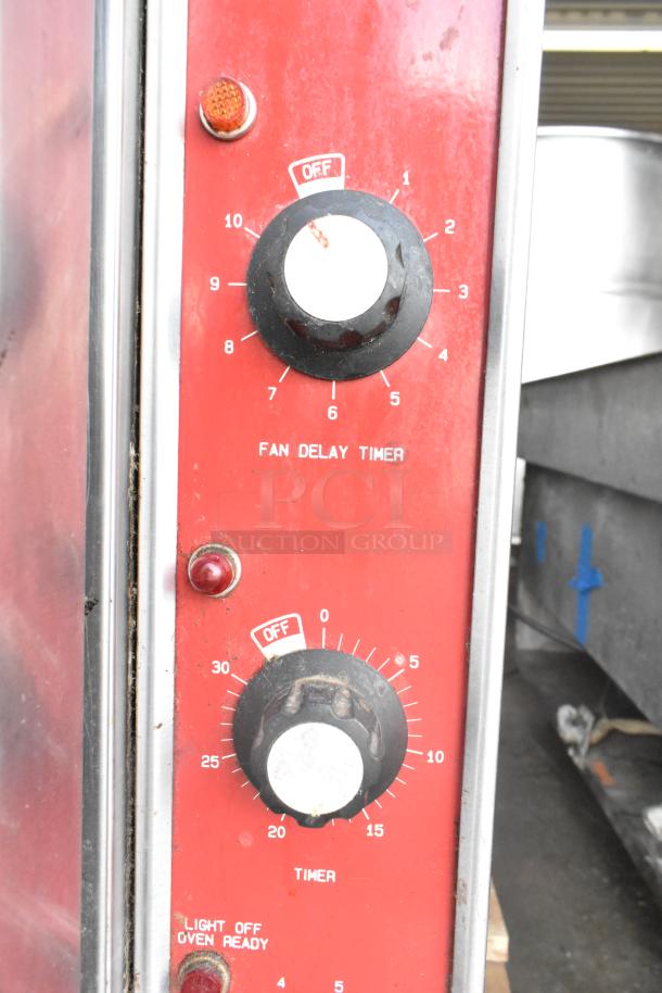 Blodgett Mark V convection oven control panel featuring fan delay timer and oven timer knobs, in used condition.