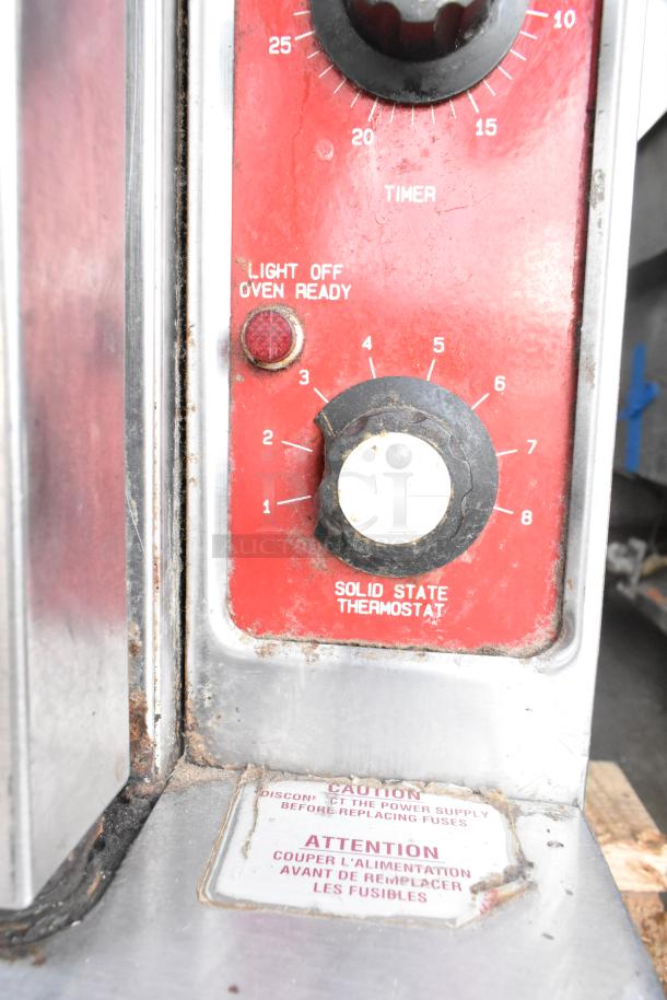 Blodgett Mark V Commercial Convection Oven, view-through doors, thermostatic controls, legs on casters, shown with timer dial.