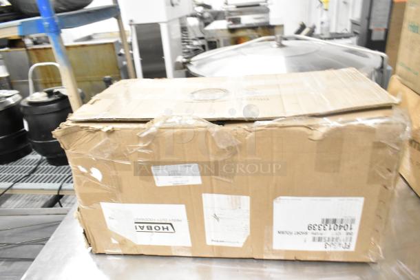 Hobart garbage disposal in original packaging, 115/230/110/220 volts, 1 phase, box shows wear with visible labels.