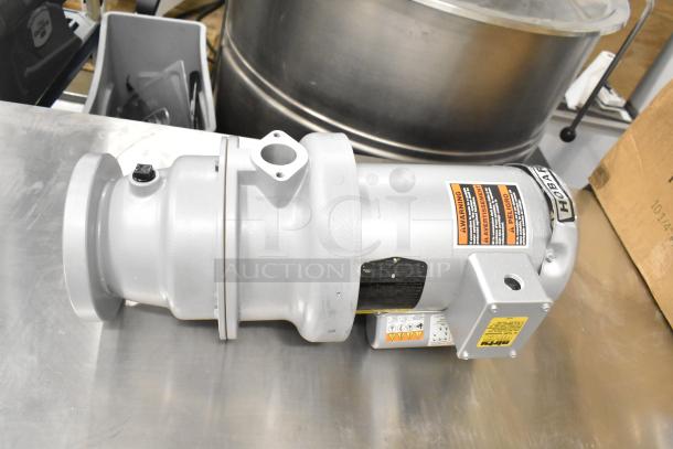 Hobart garbage disposal, 115/230/110/220 volts, 1 phase, in good condition with warning labels visible.