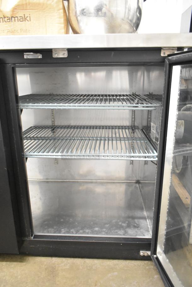Avantco 178UBB3GHC 2 Door Back Bar Cooler Merchandiser, 115V, with shelves, metal interior, and glass door, in used condition.