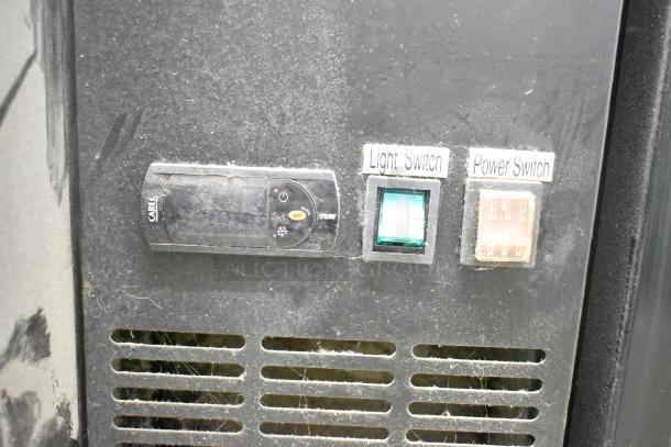 Avantco 178UBB3GHC back bar cooler controls, showing light and power switches with Carel label, moderate wear.