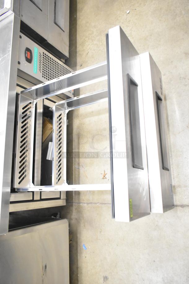 Turbo Air TCBE-36SDR-E-N6 chef base with two stainless steel drawers, commercial casters, and 115V power.