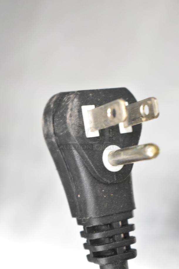 Close-up of a black three-prong plug from a Turbo Air TCBE-36SDR-E-N6 Chef Base, used for commercial appliances, 115 Volts, 1 Phase.