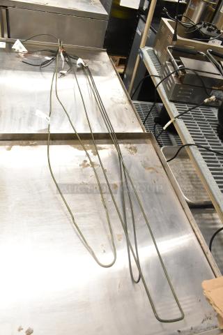 Three Heatcraft items: 3974403S Pan Heater, 39724752203 Drain Pan Heater, 39724710202 Defrost Coil Element, in good condition.