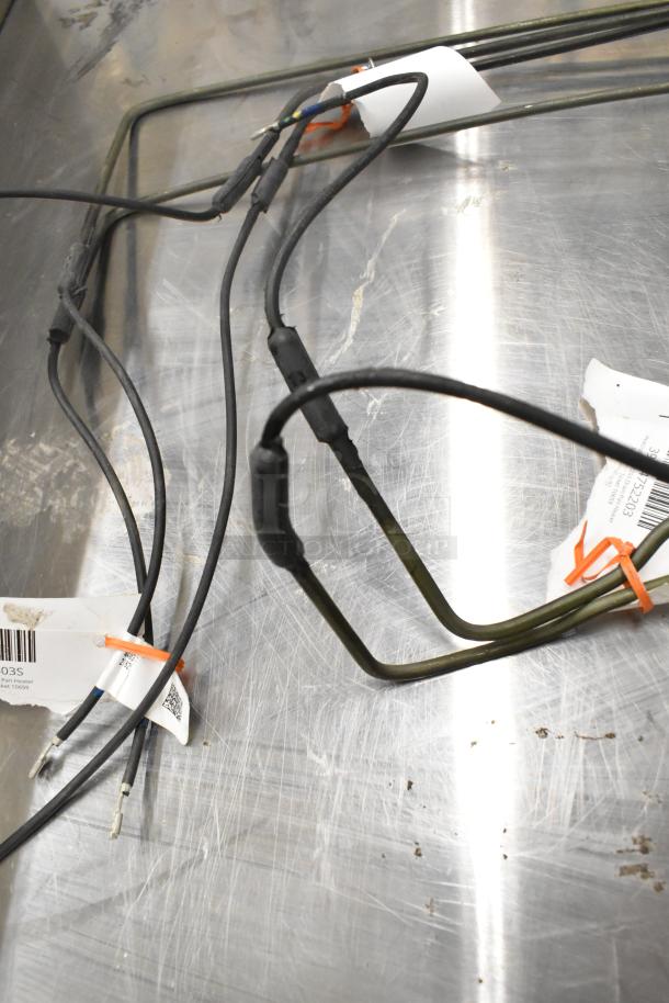 3 Heatcraft items: 4403S pan heater, 24752203 drain pan heater, 24710202 defrost coil. Tags visible.