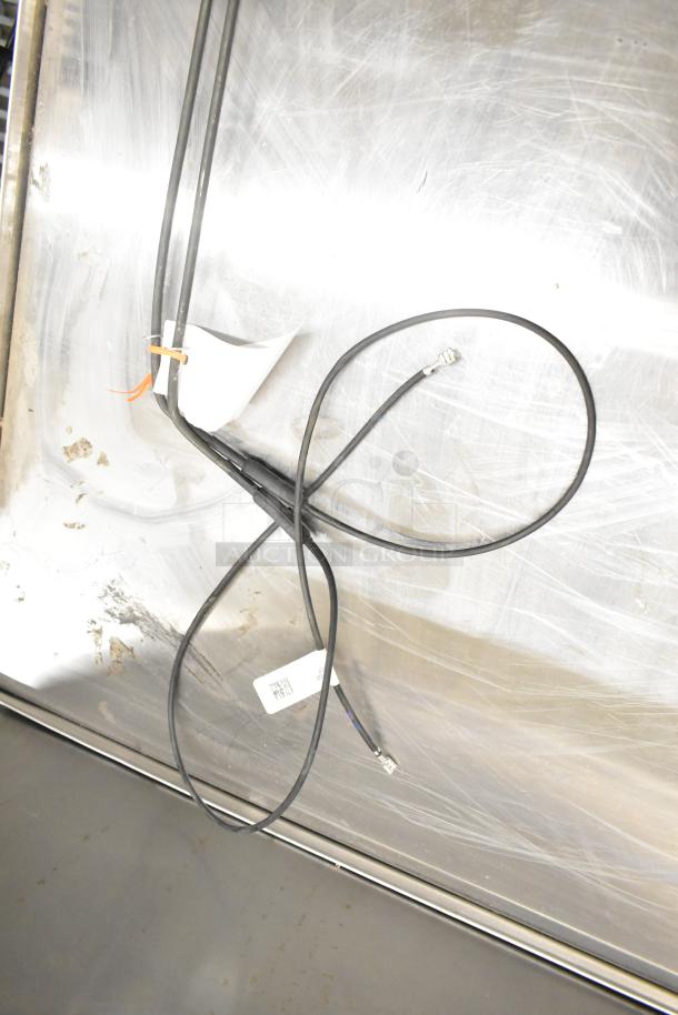 Heatcraft components: 3974403S pan heater, 24752203 drain pan heater, 24710202 defrost coil element, shown on metal surface.