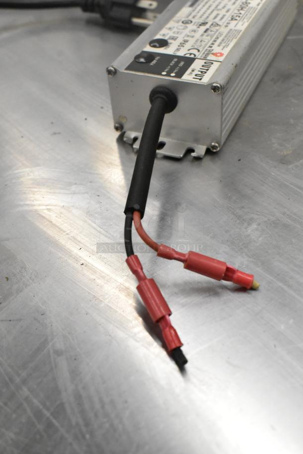 Mean Well MW HLG-80H-15A Power Supply, showing input/output wires, in good condition, with visible labels detailing specifications.