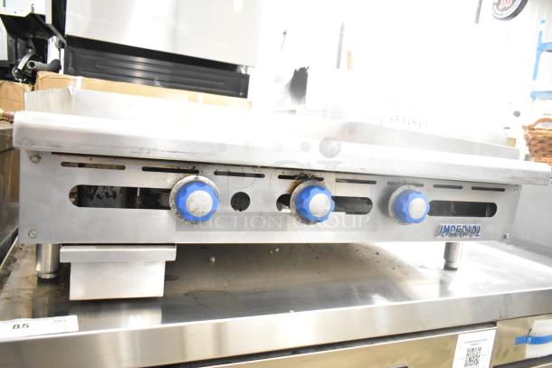 Imperial Commercial Gas Flat Top Griddle, stainless steel, three blue control knobs, small grease tray, used condition.