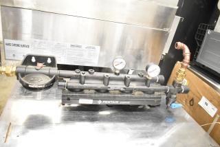 Pentair Everpure water filtration system, used condition, features pressure gauges and labeled components.