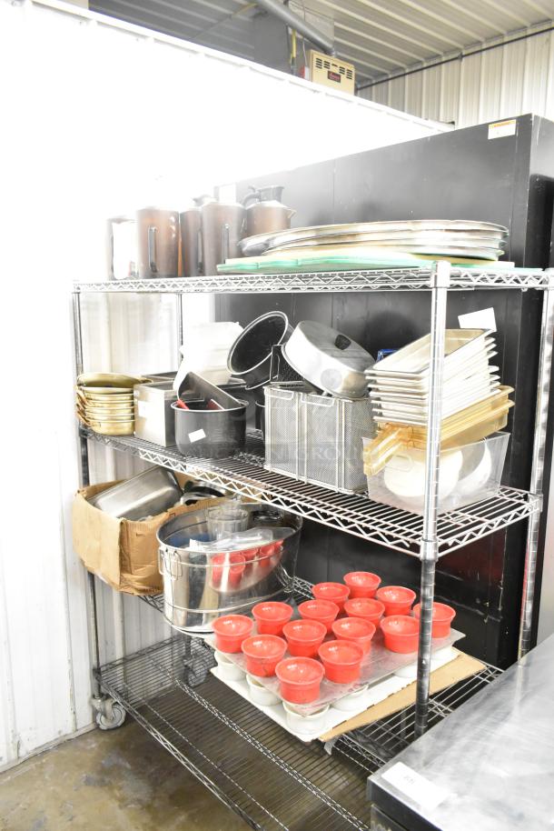 Metro lot of mixed kitchen items, including drop-in bins, poly pitchers, cutting boards, and rice cooker inserts.