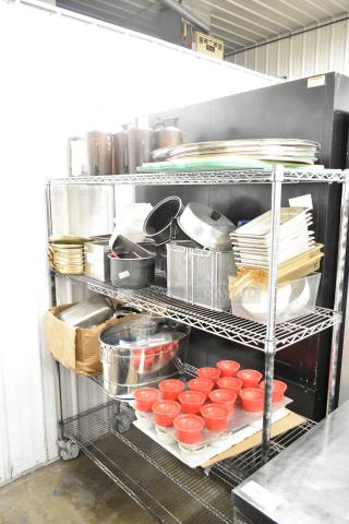 Metro lot of mixed kitchen items, including drop-in bins, poly pitchers, cutting boards, and rice cooker inserts.