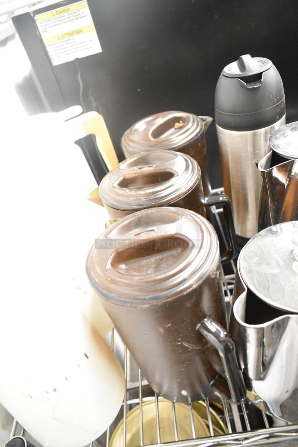 Metro Lot with drop-in bins, poly pitchers, cutting boards, rice cooker inserts. Used condition, shelving not included.