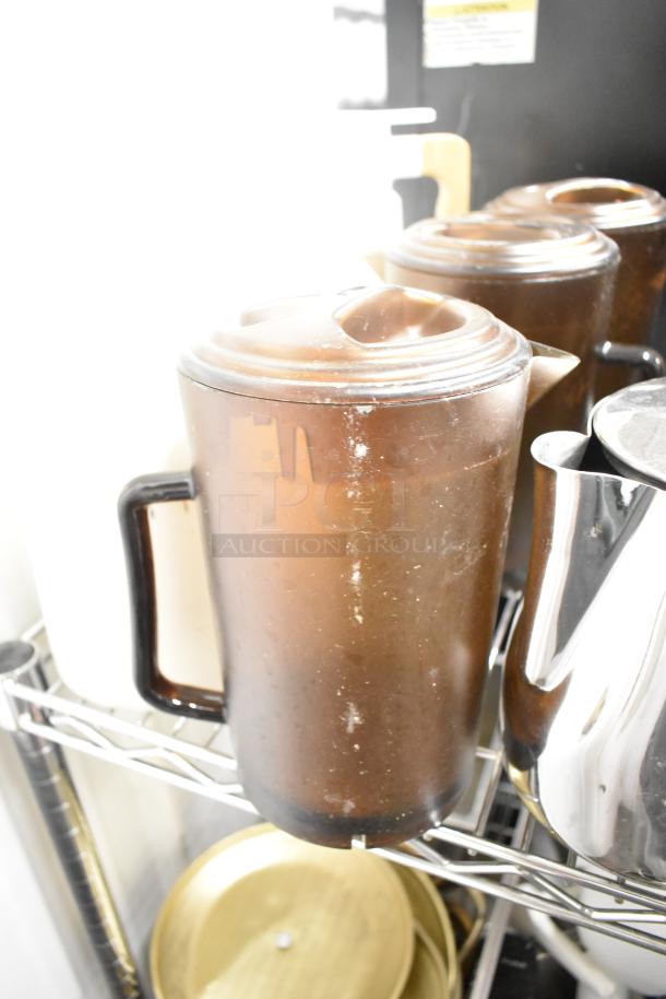 Metro lot includes drop-in bins, poly pitchers, cutting boards, rice cooker inserts. Visible poly pitcher on metal shelf. Shelving excluded.