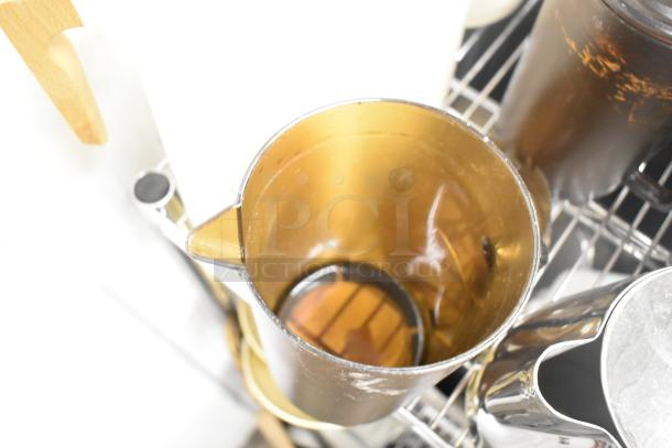 Metro Lot includes drop-in bins, poly pitchers, cutting boards, and rice cooker inserts. Items show visible wear. Shelving not included.