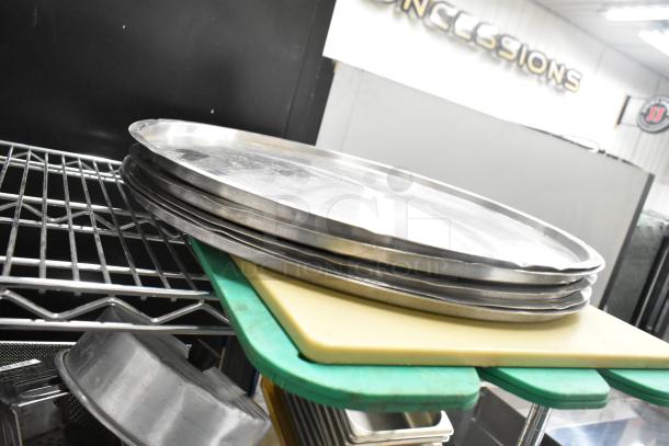 Metro lot with assorted kitchen items: drop-in bins, poly pitchers, cutting boards, rice cooker inserts; no shelving included.