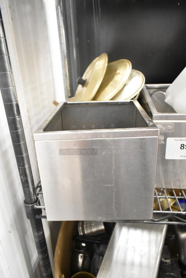 Assortment of kitchen items including drop-in bins, poly pitchers, cutting boards, and rice cooker inserts; shelving not included.