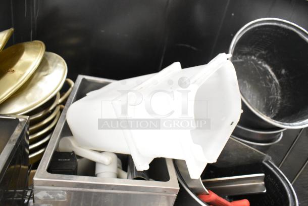 Metro lot of various items including white drop-in bins, poly pitchers, metal cutting boards, and rice cooker inserts. Shelving not included.