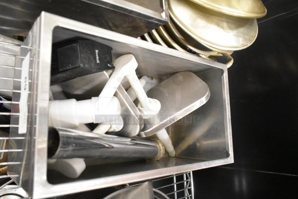 Assorted kitchen items in metal bins, including plastic parts and stainless components. No shelving included.