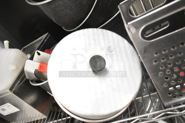 Metro lot of kitchen items including drop-in bins, poly pitchers, cutting boards, and rice cooker inserts. Shelving unit not included.