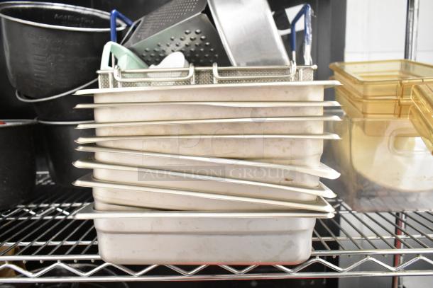 Metro lot of kitchen items including metal bins, poly pitchers, cutting boards, and rice cooker inserts on a shelf. Shelving not included.