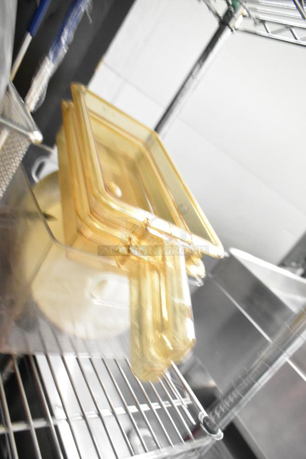 Metro Lot of kitchen items including drop-in bins, poly pitchers, and cutting boards on a metal shelf. Shelving not included.