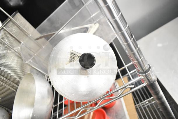 Metro lot of kitchen items: drop-in bins, poly pitchers, cutting boards, rice cooker inserts, utensils. Shelving not included.