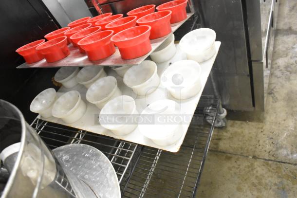 Metro lot featuring red and white drop-in bins and assorted kitchen items; shelving unit not included.