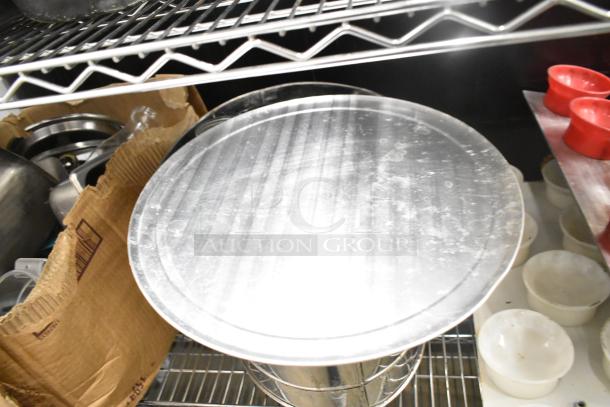 Metro lot of kitchen items, including metal drop-in bins, utensils, and red poly pitchers. No shelving unit included.