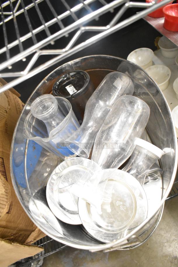 Metro lot of kitchen items including clear drop-in bins and pitchers. Some items show light wear, no shelving included.