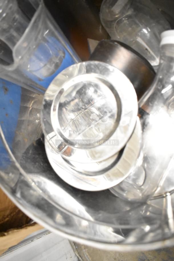 Assorted metro lot with drop-in bins, poly pitchers, cutting boards, and rice cooker inserts. Items in varied condition.