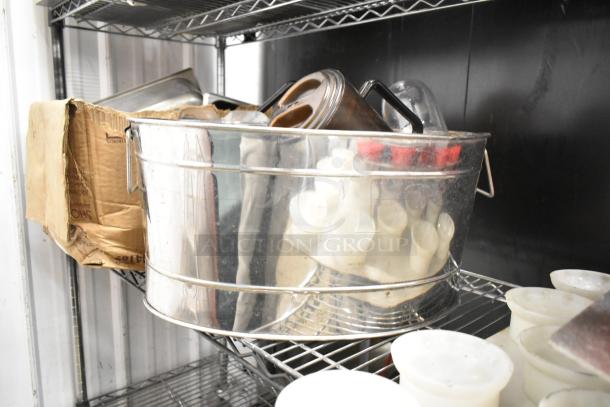 Metro lot of kitchen items including drop-in bins, poly pitchers, cutting boards, rice cooker inserts, utensils. No shelving unit.