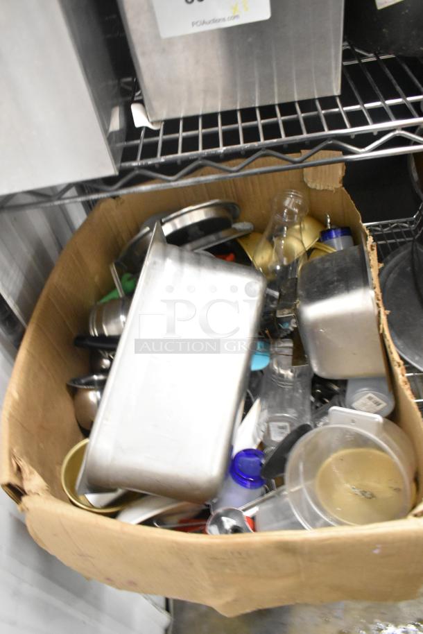 Metro lot of various kitchen items including drop-in bins, poly pitchers, cutting boards, and utensils. Condition varies.