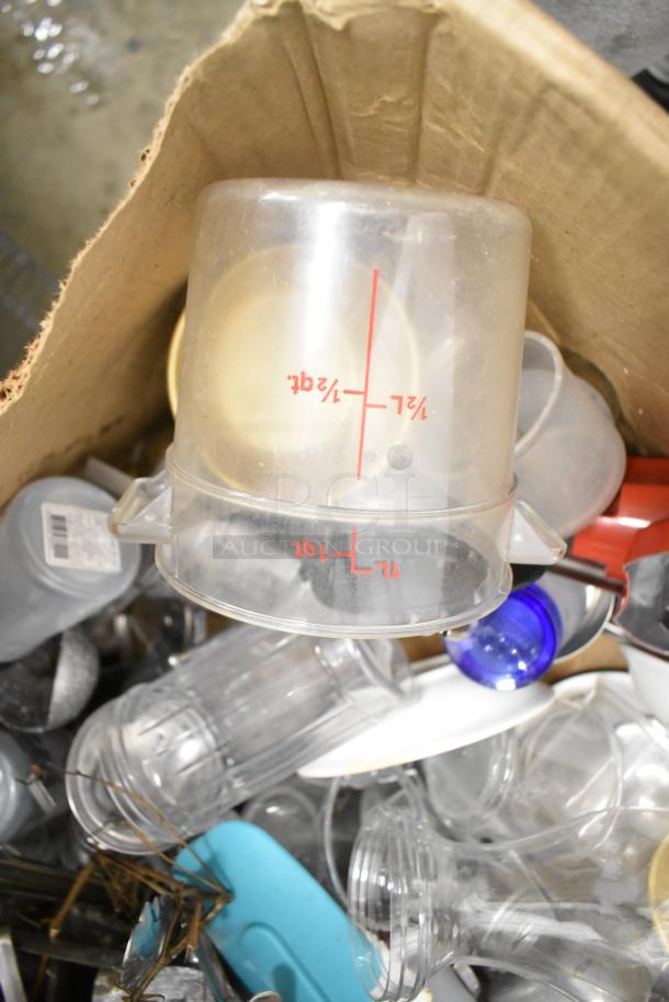 Metro lot of kitchen items including drop-in bins, poly pitchers, cutting boards, and utensils in used condition.