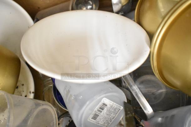 Mixed kitchenware lot including plastic drop-in bins, poly pitchers, cutting boards, rice cooker inserts, various utensils.