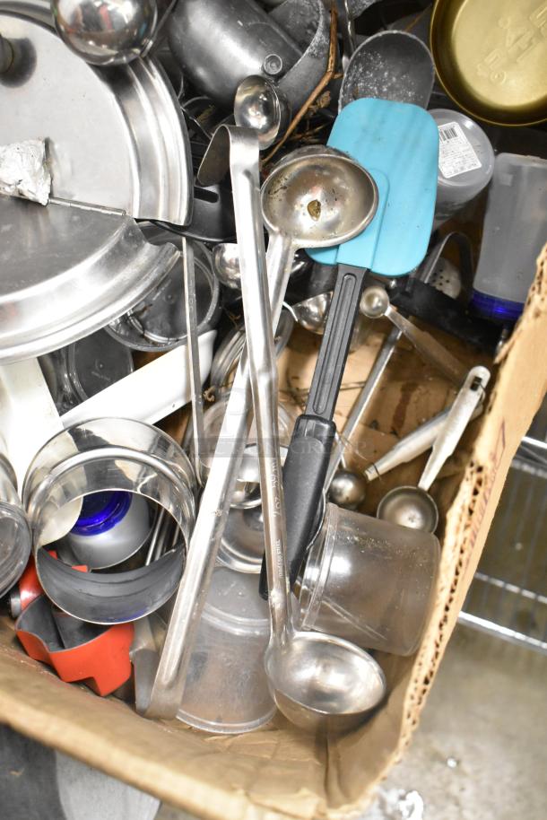 Metro lot with drop-in bins, poly pitchers, cutting boards, rice cooker inserts, utensils. Used condition, no shelving.