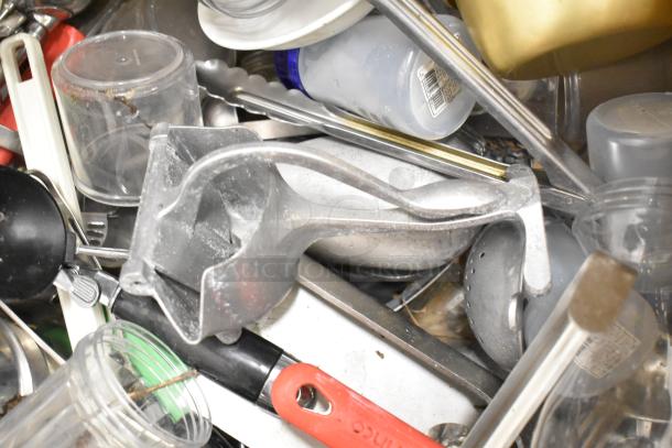 Metro lot of various kitchen items including drop-in bins, poly pitchers, cutting boards, and utensils. No shelving unit.