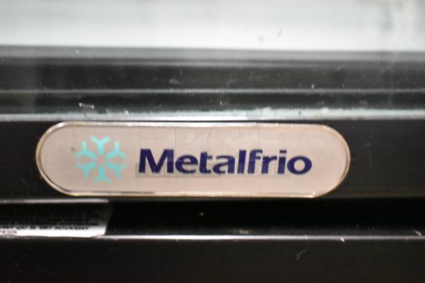 Metalfrio NG26CHC commercial cooler, single door, 115 volts, 1 phase, model label visible, sturdy construction.