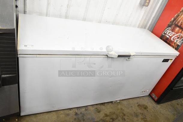 Titan XTCF20 chest freezer with hinge lid, white, 115 volts, 1 phase, used, model tag visible, minor wear marks.
