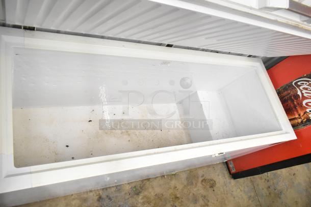 Titan XTCF20 chest freezer with hinge lid, 115 volts, 1 phase. Moderate wear visible inside. Ideal for large storage.