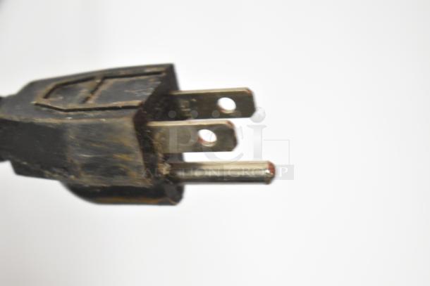 Close-up of a power plug for Titan XTCF20 Chest Freezer, showing standard 115-volt compatibility with three-prong design.