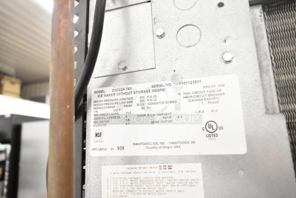 Manitowoc ID0322A-161 ice machine with SPA160 dispenser label. Features 115V, 1 phase, details design pressures and certifications.