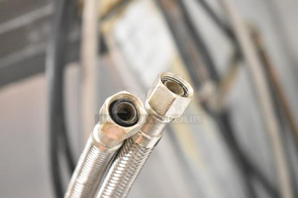 Two braided metal water connectors for Manitowoc commercial ice machine, part of the ID0322A-161 model setup.