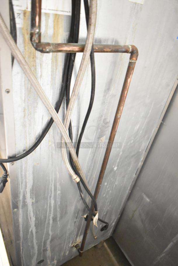 Commercial ice machine with visible wiring and pipes, Manitowoc ID0322A-161 model, 115 Volts, 1 Phase.