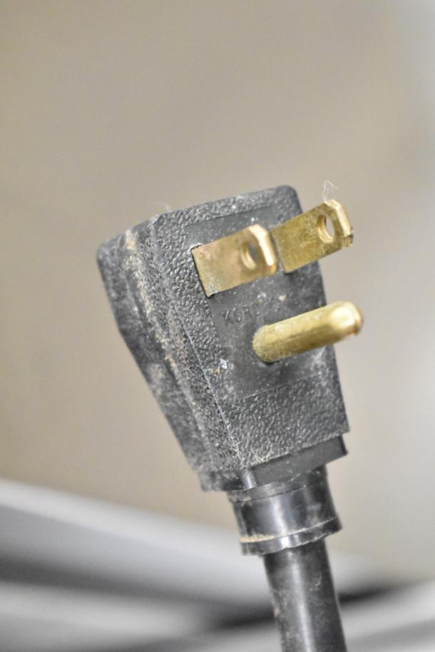 Close-up of a three-prong electrical plug for the True T-49 Commercial Cooler, 115 Volts, 1 Phase.