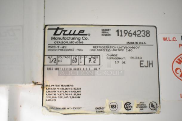True T-49 Commercial 2 Door Cooler label, 115V, 1 Phase, Model T-49. Shows design pressures, refrigerant, and serial number.