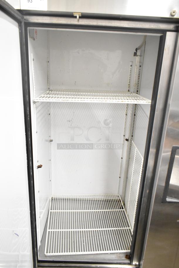 True T-49 Commercial 2 Door Reach In Cooler, 115V, 1 Phase, good used condition, white interior shelves, metal exterior.
